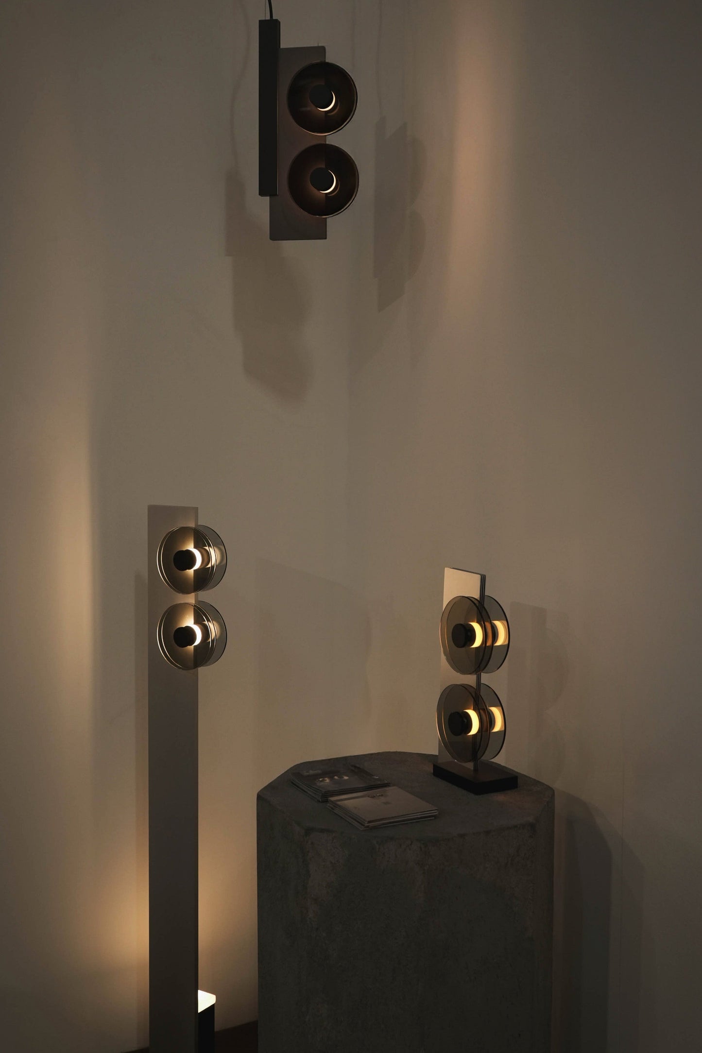 Set of wall-mounted speakers on a plain wall