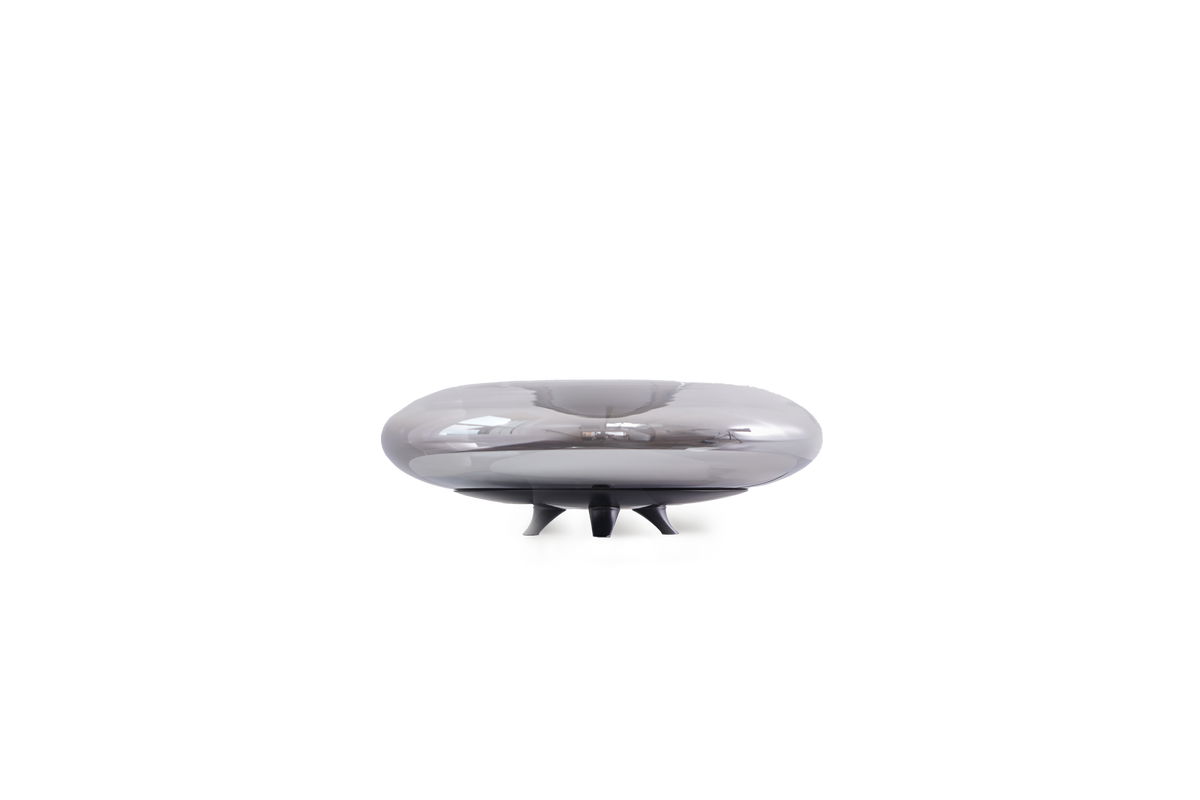 Silver UFO-like object on a white background