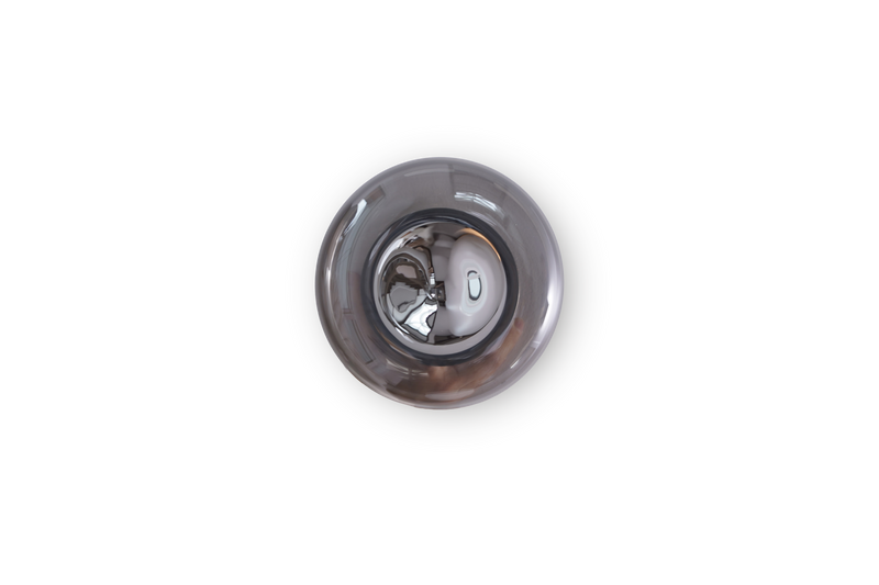 Metallic sink drain plug on a white background