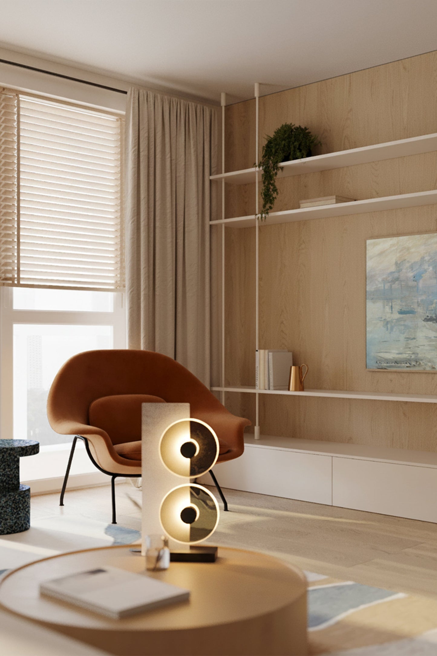 Modern living room with a brown armchair, round coffee table, and decorative lamp.