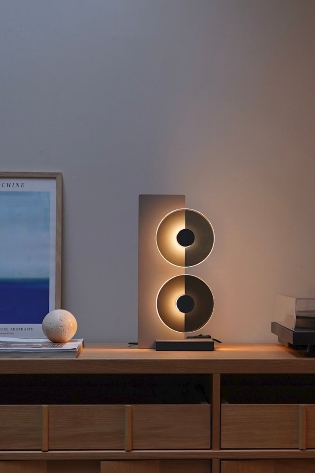 Modern table lamp on a wooden surface with a blurred background
