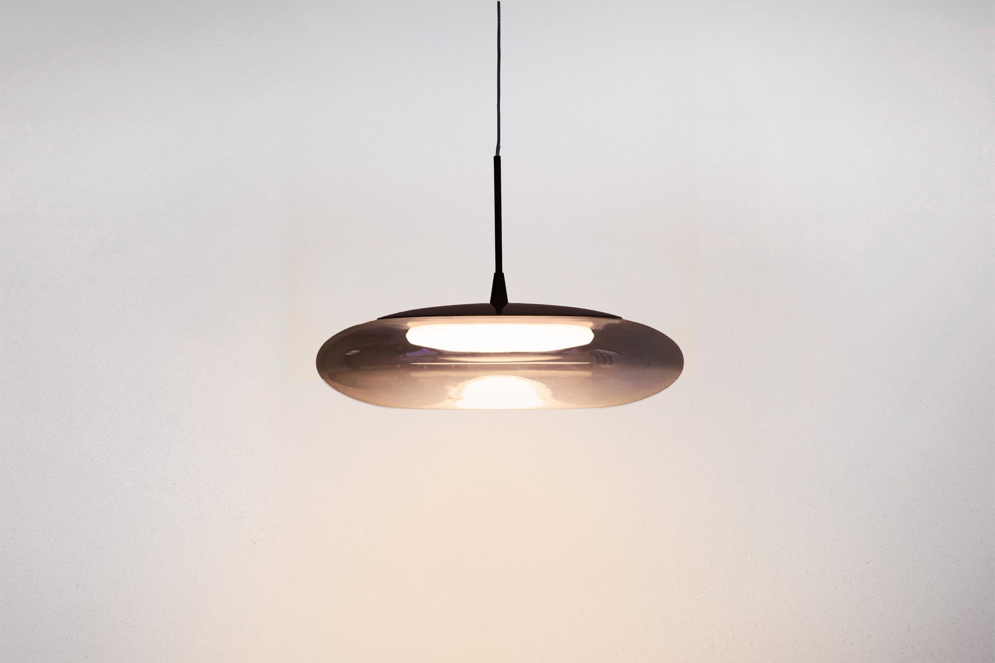 Pendant light fixture on a plain background