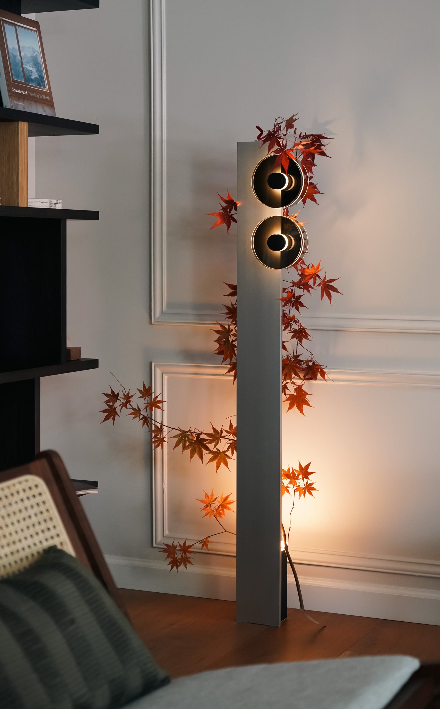 Decorative floor lamp with autumn leaves in a room setting