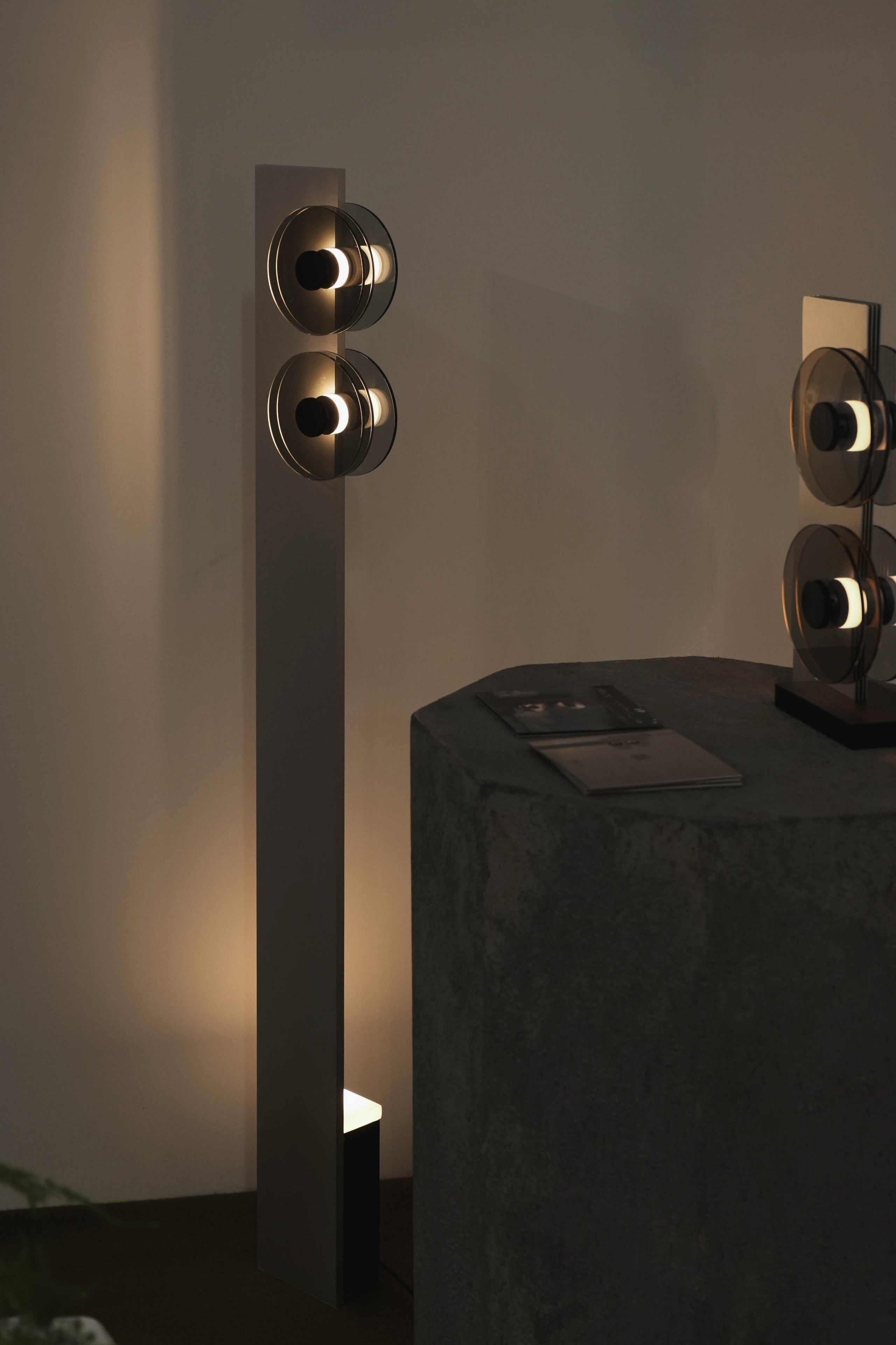 Modern decorative sculptures on a dark surface with a neutral background